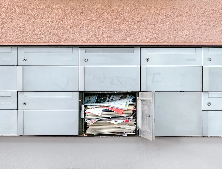 a cluttered mailbox