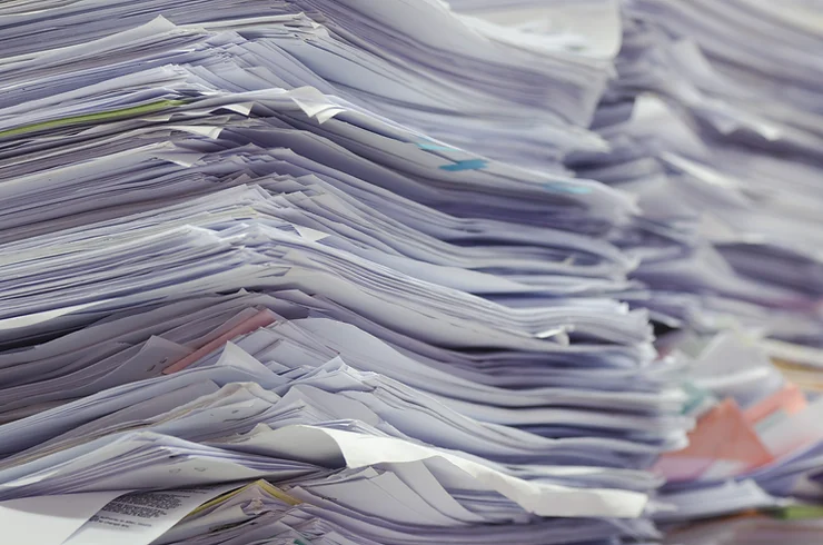 a cluttered stack of documents